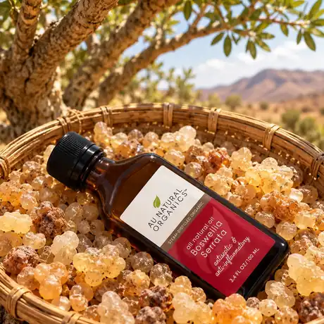 Boswellia Serrata Essential Oil bottle with frankincense resin and leaves