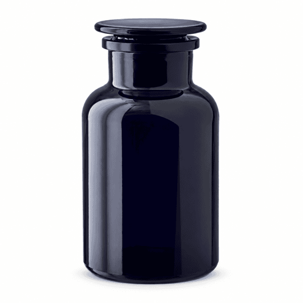 Miron violet glass apothecary jar with flat glass stopper on white